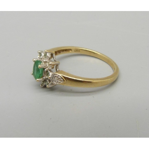 1034 - A 9ct gold, emerald and diamond ring, 2.9g, T