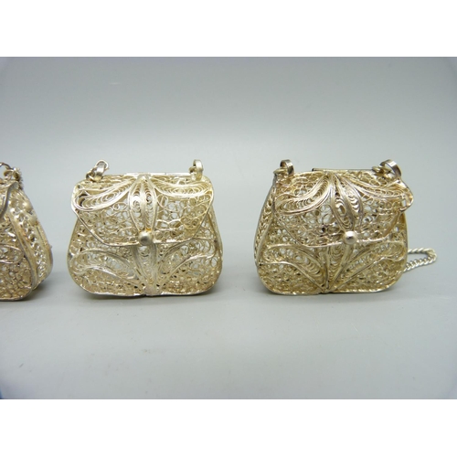 1035 - A collection of eight white metal filigree dolls purses, one a/f