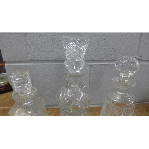 1043 - Three crystal decanters including one thistle shaped **PLEASE NOTE THIS LOT IS NOT ELIGIBLE FOR POST... 