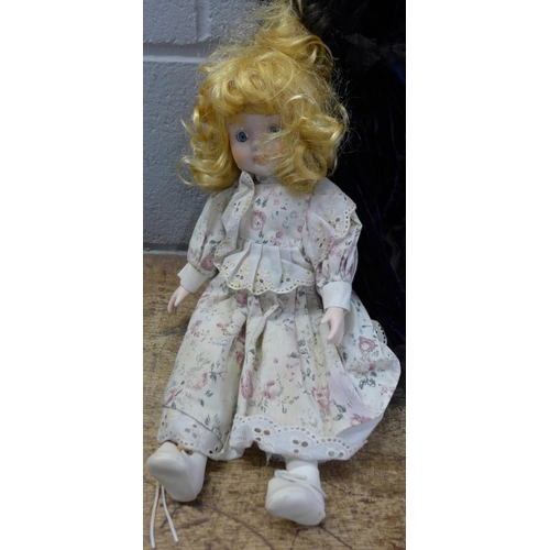 1044 - Three porcelain dolls **PLEASE NOTE THIS LOT IS NOT ELIGIBLE FOR POSTING AND PACKING**