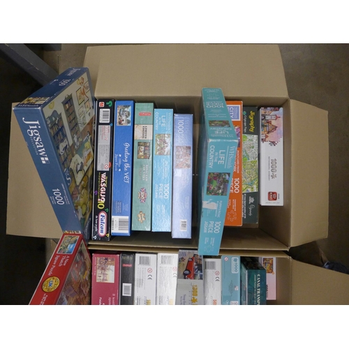 1090 - Two boxes of jigsaws; 19 x 1000 and 6 x 500 including Waddingtons, Gibsons, Falcon, King, etc. **PLE... 