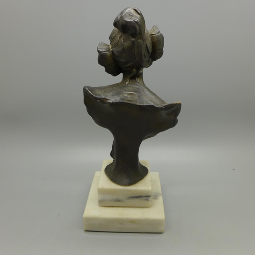 655 - A French metal statuette on a marble base