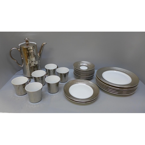 664 - A Royal Worcester silver finish coffee set, one cup chip to rim