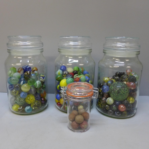 669 - Four jars of vintage marbles including clay