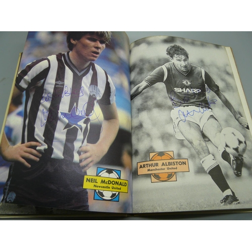 710 - Football; a Topical Times, football book 1986 containing ten signatures from former footballers incl... 