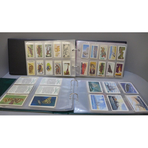 711 - A collection tea cards, in three albums