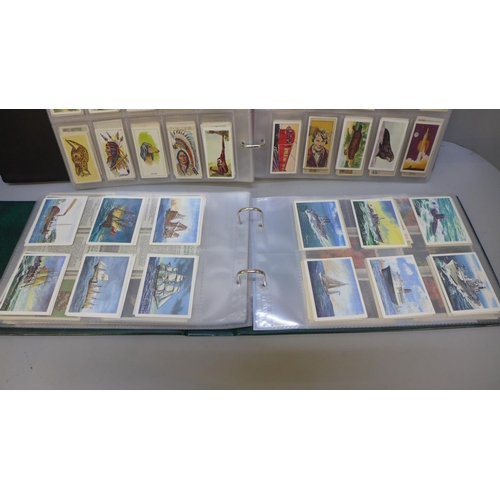 711 - A collection tea cards, in three albums