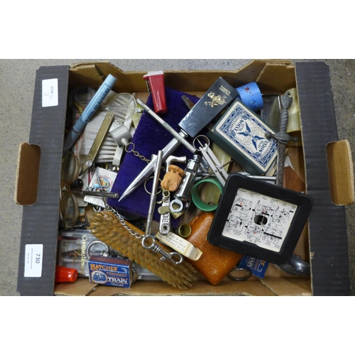 730 - Assorted items including a Bakelite tape measure and a cigarette case with part map of Africa