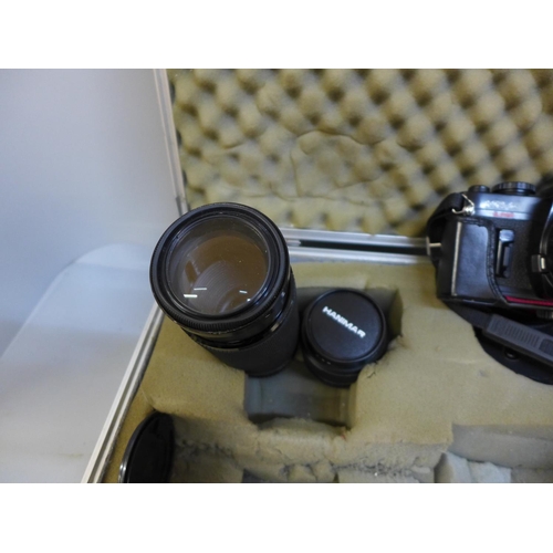 780 - A Ricoh KR-10 camera and lenses in case