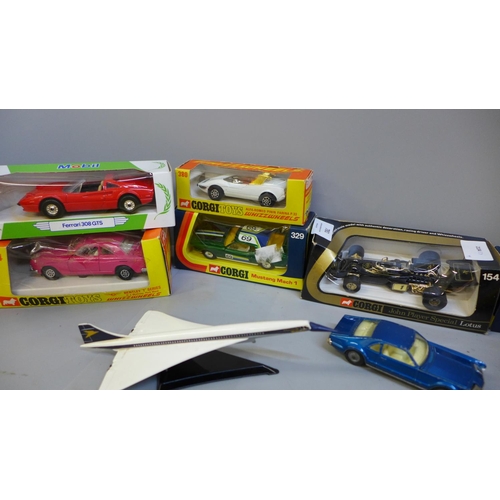 781 - A collection of Corgi model vehicles including Concorde, John Player's Lotus, Bentley and 350SL