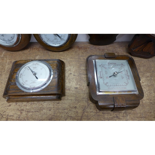 812 - Six wooden barometers, two with thermometers