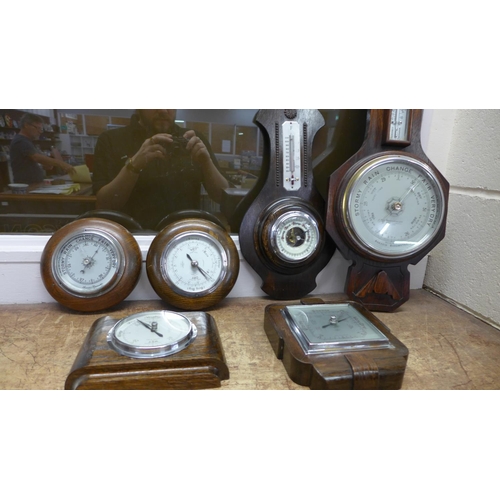 812 - Six wooden barometers, two with thermometers