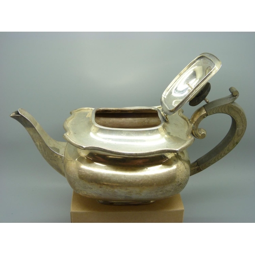 835 - A three piece silver tea service, 1140g