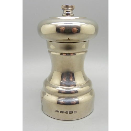 858 - A silver pepper grinder