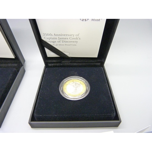 878 - Two boxed proof coins, a RAF Centenary Badge £2 2018 and a 250th Anniversary of Captain James Cook's... 