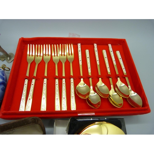 908 - Dessert spoons and forks, a metal figure, etc.