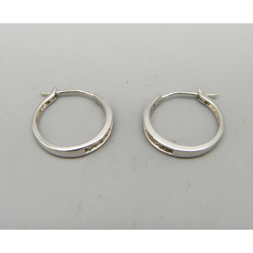 917 - A pair of 9ct white gold and diamond earrings, 1.8g