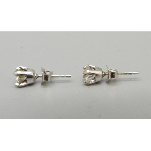 919 - A pair of 18ct gold and diamond ear studs, approximately 0.70ct total carat weight