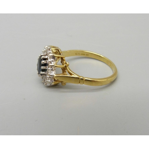 924 - An 18ct gold, sapphire and diamond cluster ring, London 1975, 0.6 carat diamond weight, 4.9g, R