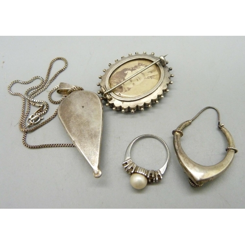 933 - A Victorian brooch, a pendant and chain, a ring, O, and a single earring