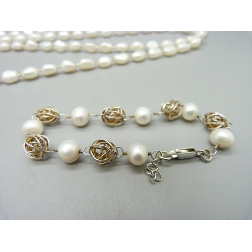 954 - A pearl necklace and two bracelets