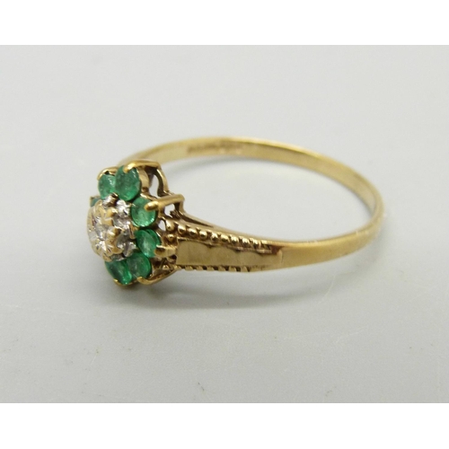 965 - A 9ct gold, emerald and diamond cluster ring, 1.9g, S