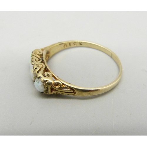 969 - A 9ct gold, three stone opal and diamond ring, 2.6g, R