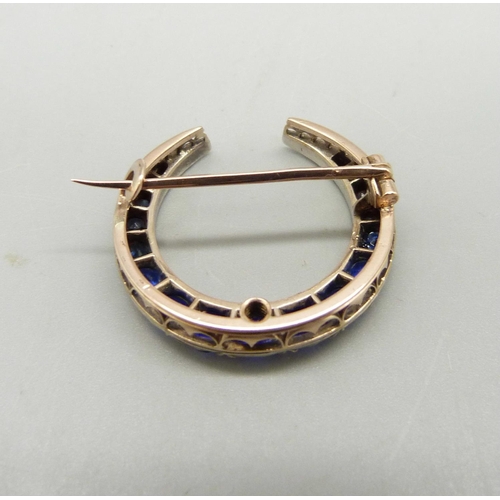 974 - A Victorian blue stone crescent brooch, (gold back, silver setting)