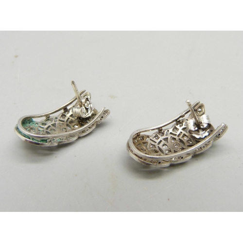 980 - A pair of Art Deco earrings set with seventy-two diamonds, test as platinum, 10mm wide