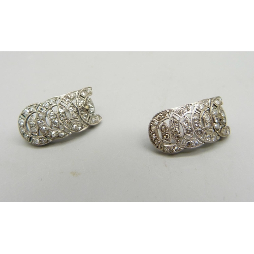 980 - A pair of Art Deco earrings set with seventy-two diamonds, test as platinum, 10mm wide