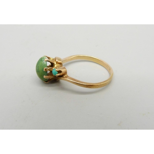 989 - A yellow metal and turquoise ring, control marks on the outside of the shank, lacking one stone, 3.1... 