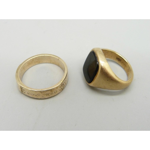 990 - A 9ct gold signet ring, 6.9g, H, and a yellow metal ring with opening front, 3.5g, N