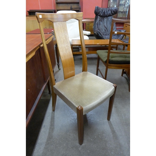 117 - A Nathan teak extending dining table and four chairs