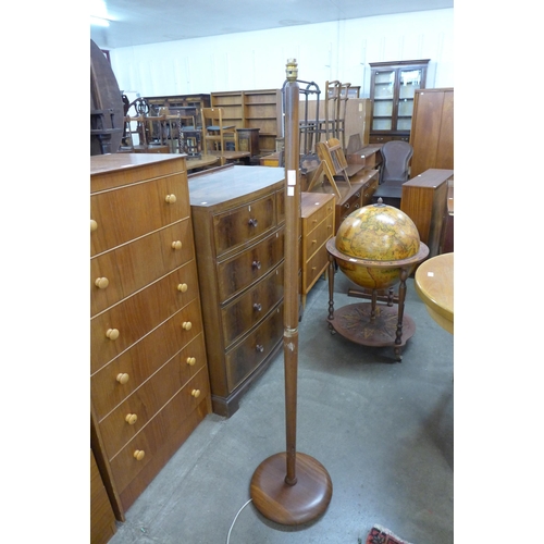 122 - A teak floor standing lamp