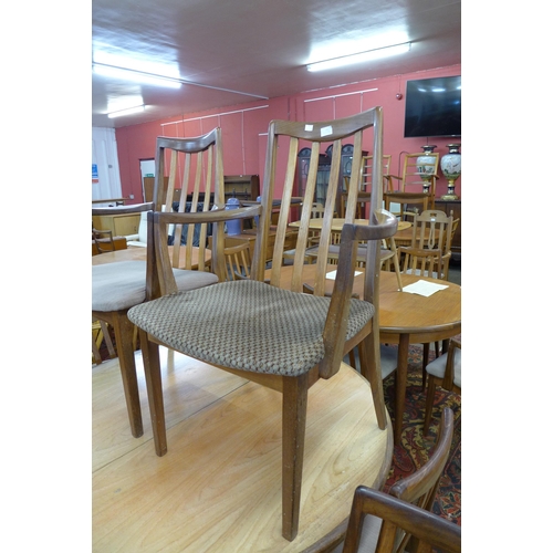 124 - A G-Plan Fresco teak extending dining table and nine chairs