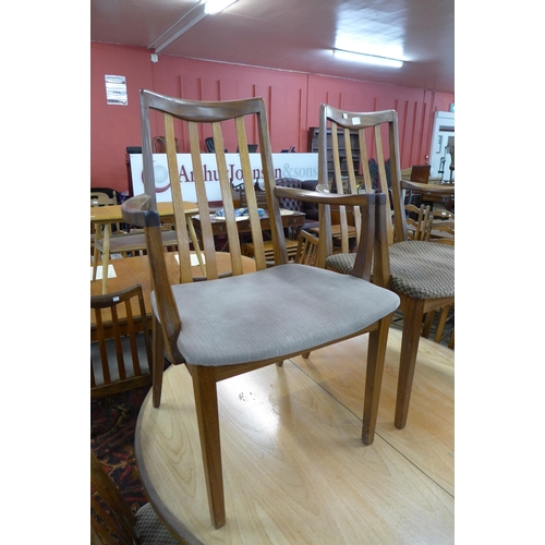 124 - A G-Plan Fresco teak extending dining table and nine chairs