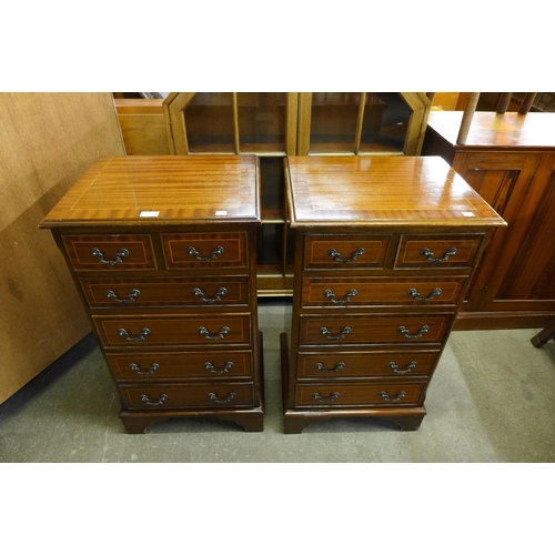 152 - A pair of inlaid mahogany chests of drawers