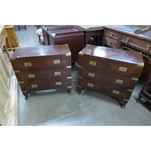 162 - A pair of small eastern hardwood and brass inlaid chests of drawers