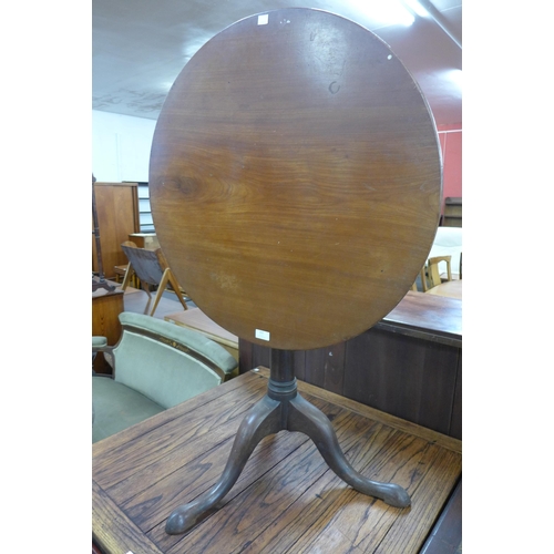 163 - A George III mahogany circular bird cage action tripod tea table