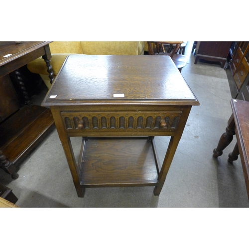 183 - A carved oak single drawer side table