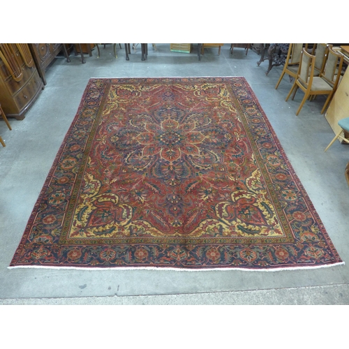 191 - An Iranian red ground Tabriz rug,  385 x 305cms