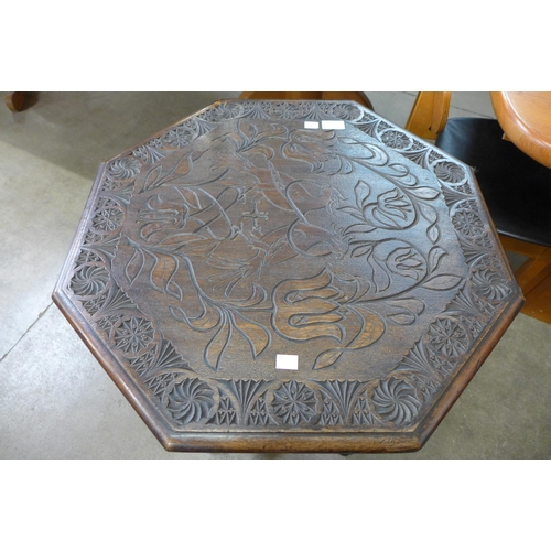 216 - A carved mahogany octagonal centre table