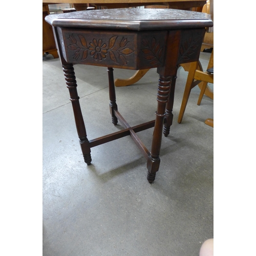 216 - A carved mahogany octagonal centre table