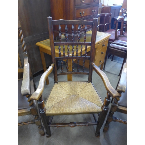 242 - A pair of early 20th Century oak barleytwist carver chairs and a George III style elm spindle back c... 