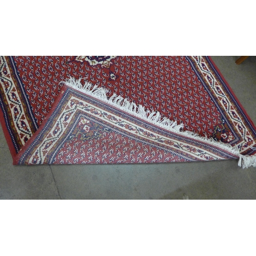 261 - A red ground rug