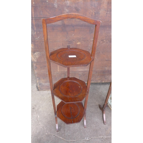 278 - A mahogany and brass Islamic pattern cake stand and an oak cake stand