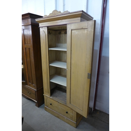 281 - A Victorian Aesthetic Movement scumbled pine wardrobe (converted to a shelved cupboard)