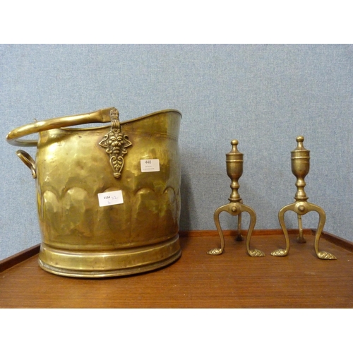 440 - A brass coal scuttle and a pair of brass andirons