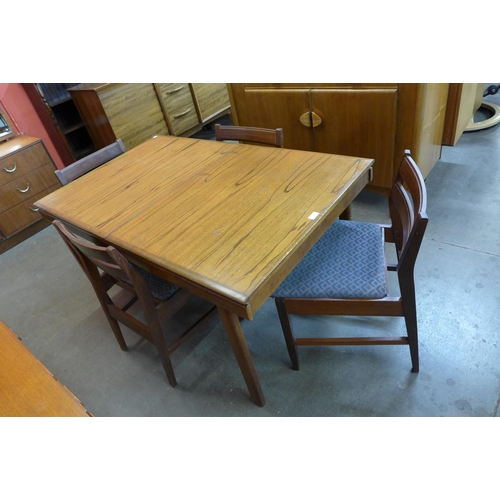 85 - A White & Newton teak extending dining table and four chairs