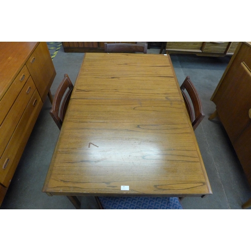 85 - A White & Newton teak extending dining table and four chairs